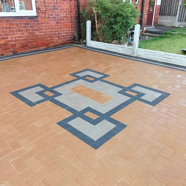 block paved driveway with centre feature